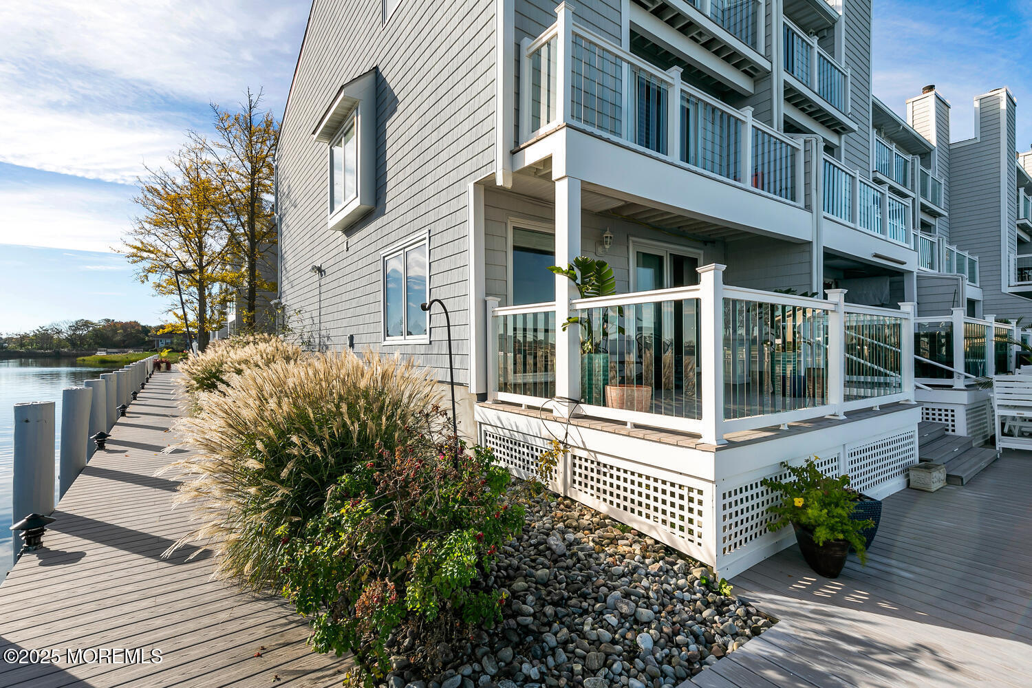 165 Riddle Avenue, Unit 7 Long Branch, NJ 07740 - Photo 10 of 87 a view of a house with a large window and flower plants