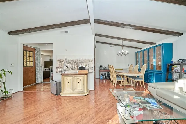 a living room with stainless steel appliances kitchen island granite countertop furniture and a kitchen view