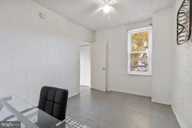 a view of livingroom with window and furniture
