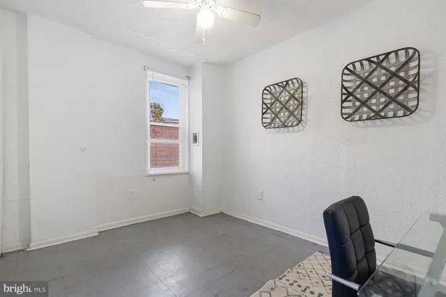 a view of workspace with painting on the wall