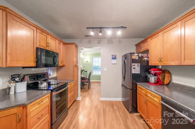 a bathroom with a toilet a sink and a large mirror