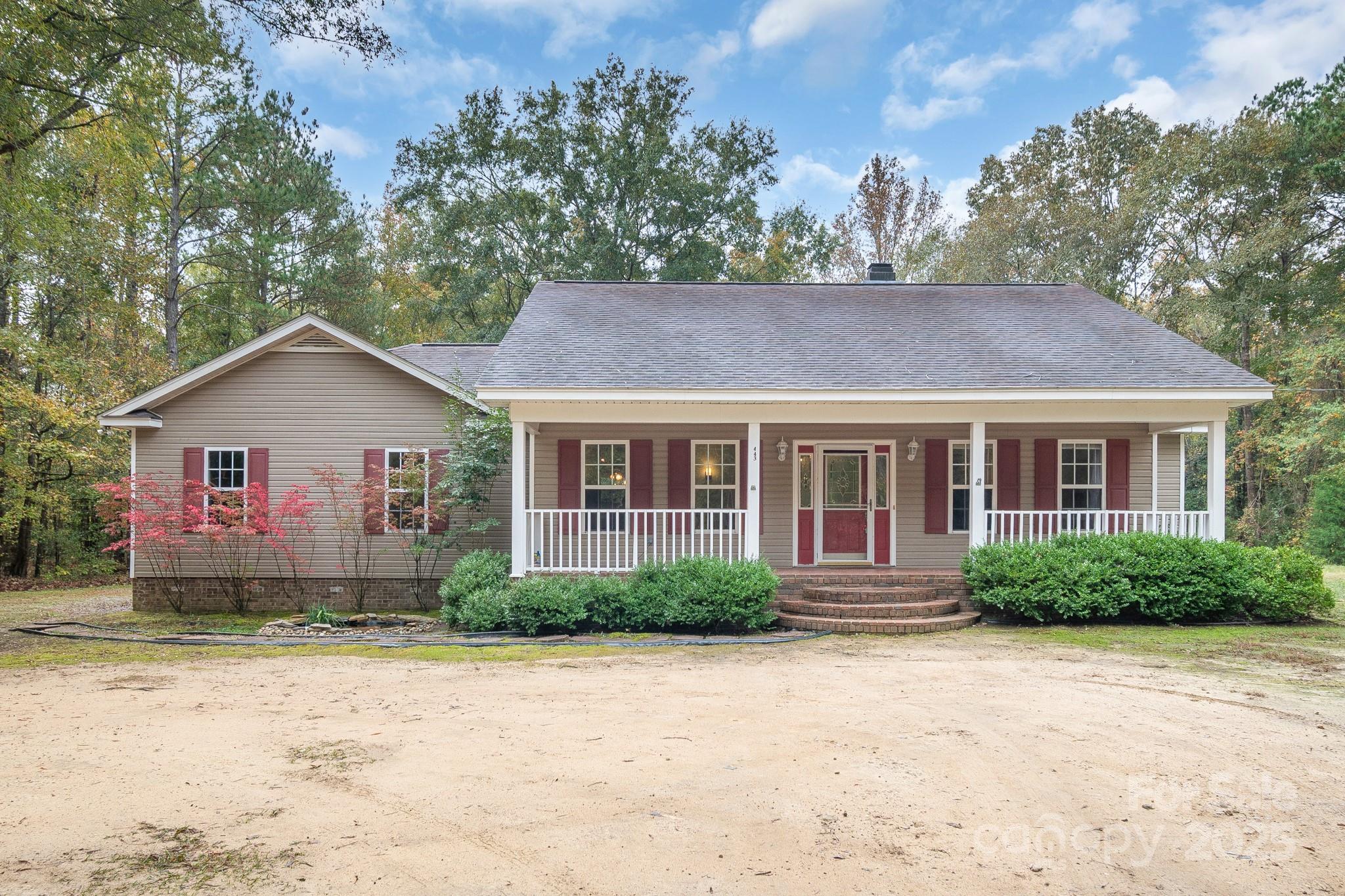 443 State Rd S-28-101 Elgin, SC 29045 - Photo 36 of 45 a front view of a house with a yard and trees