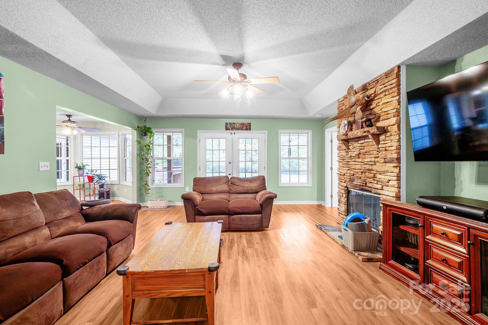 443 State Rd S-28-101 Elgin, SC 29045 - Photo 4 of 45 a living room with furniture and a flat screen tv