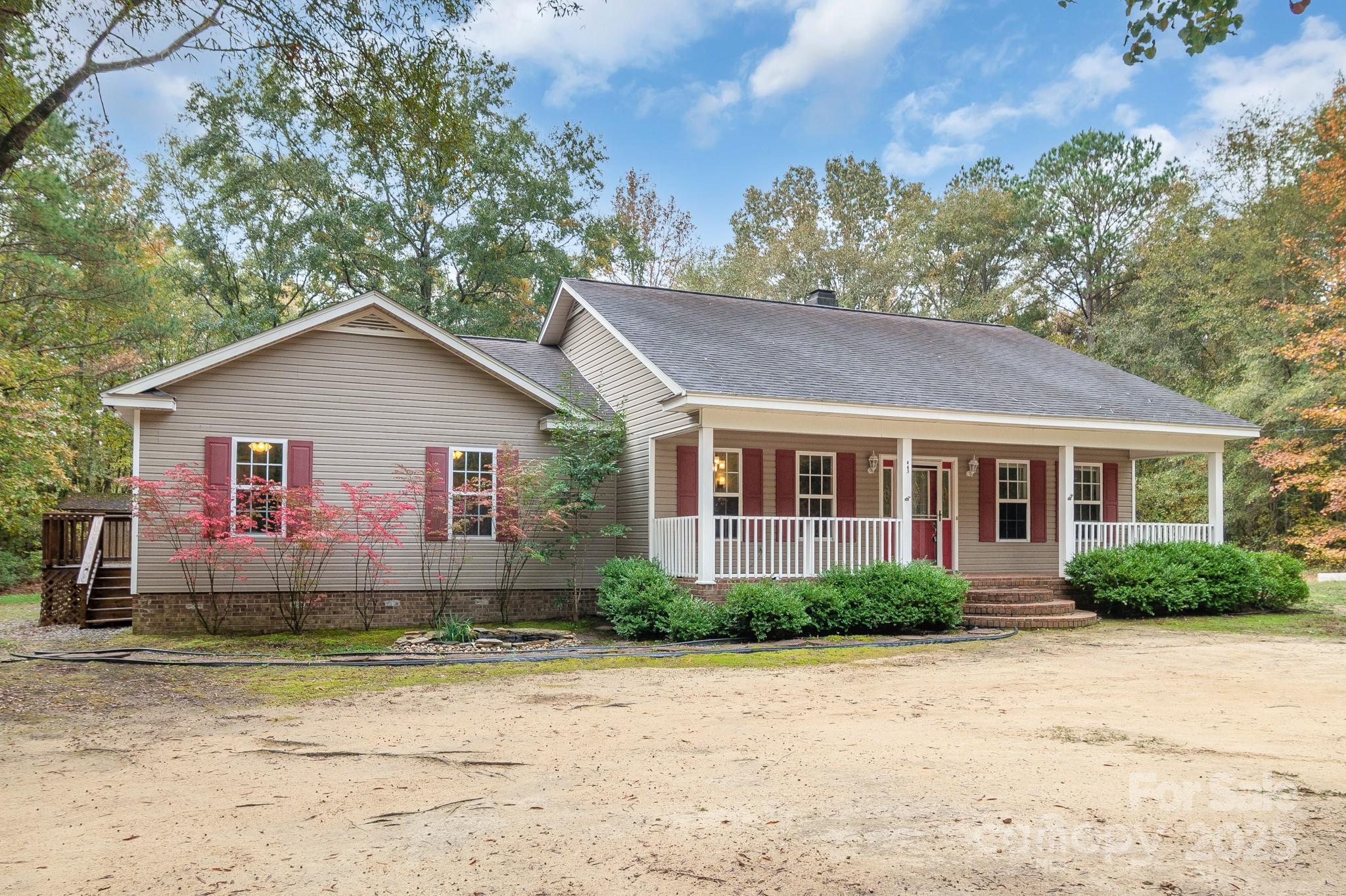 443 State Rd S-28-101 Elgin, SC 29045 - Photo 41 of 45 a front view of house with yard and trees around