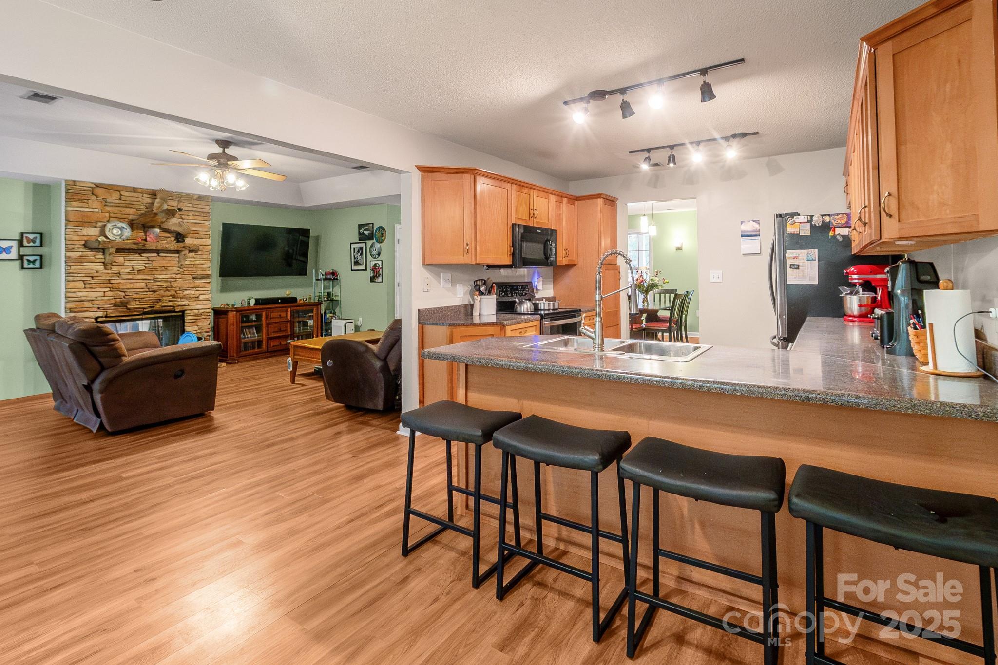 443 State Rd S-28-101 Elgin, SC 29045 - Photo 10 of 45 a living room with furniture and a flat screen tv