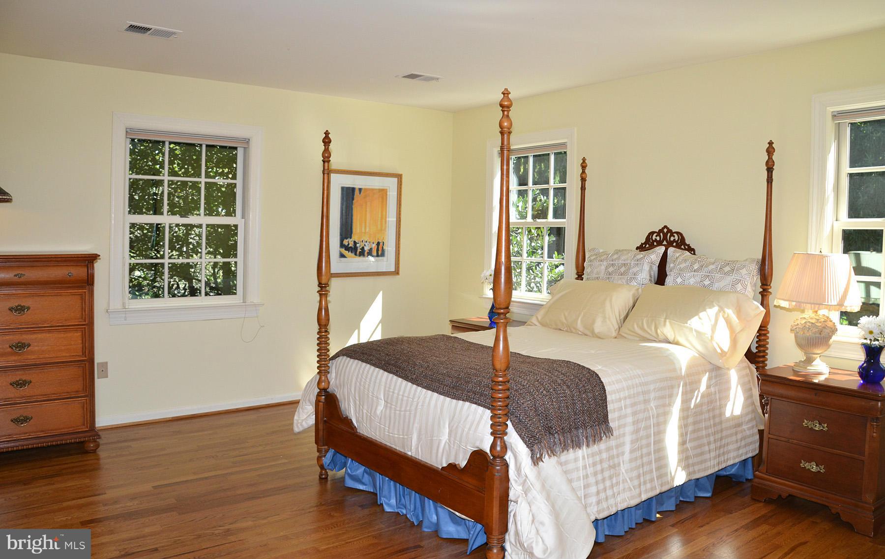 7011 Holyrood Drive McLean, VA 22101 - Photo 27 of 30 a bedroom with a bed and wooden floor