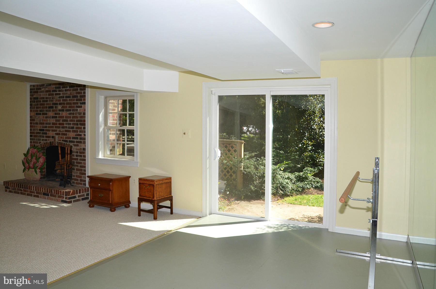 7011 Holyrood Drive McLean, VA 22101 - Photo 30 of 30 a living room with a large window and a fireplace
