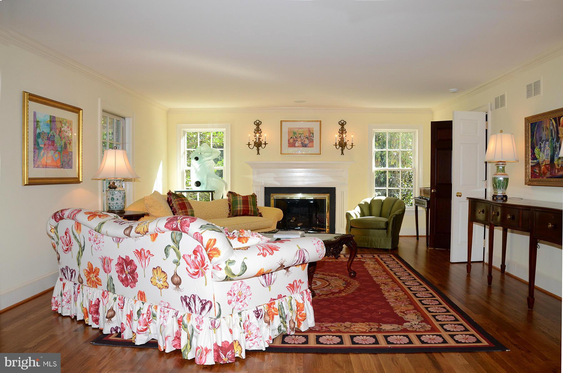 7011 Holyrood Drive McLean, VA 22101 - Photo 4 of 30 a living room with furniture fireplace and rug