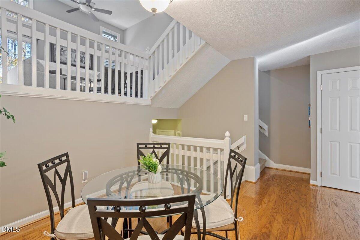 100 Hunting Chase, Unit 1D Cary, NC 27513 - Photo 14 of 29 a view of a dining room with furniture and wooden floor