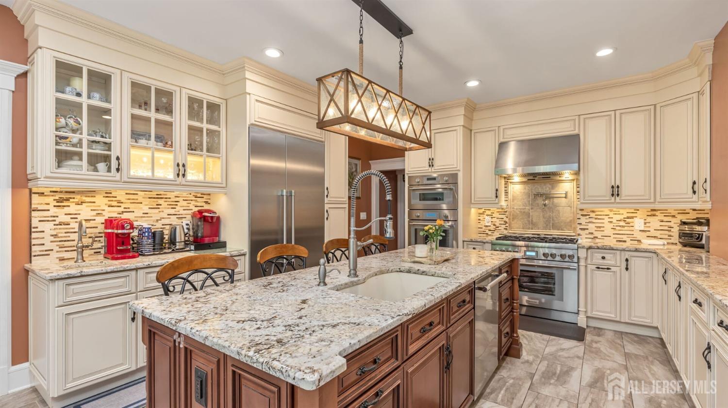 a kitchen with stainless steel appliances granite countertop a sink and stove