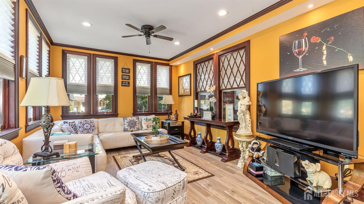 1275 Denmark Road Plainfield, NJ 07062 - Photo 19 of 87 a living room with furniture flat screen tv and a large window