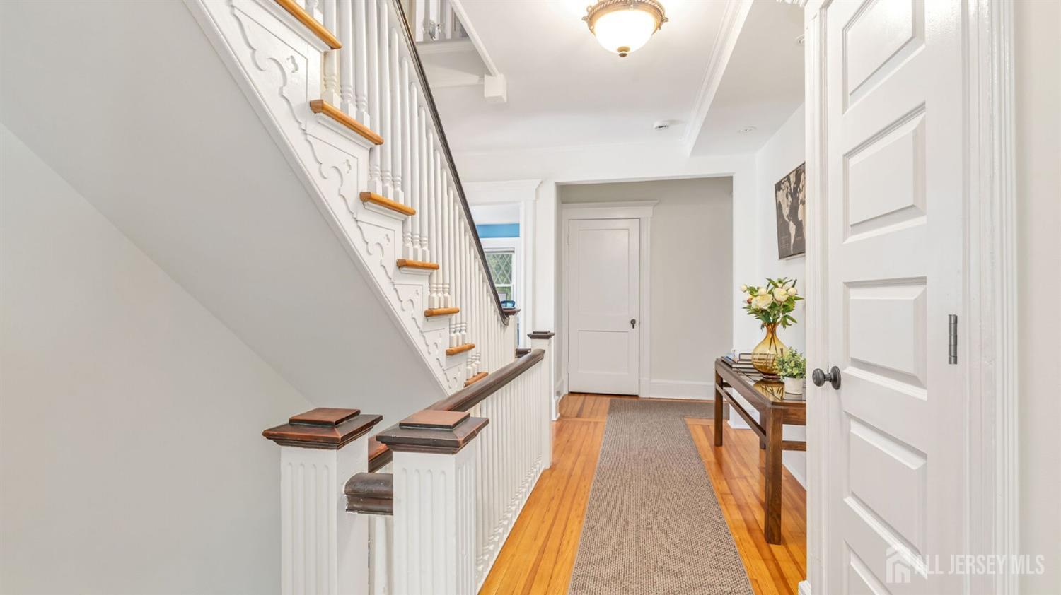 1275 Denmark Road Plainfield, NJ 07062 - Photo 34 of 87 a view of a hallway with wooden floor and staircase