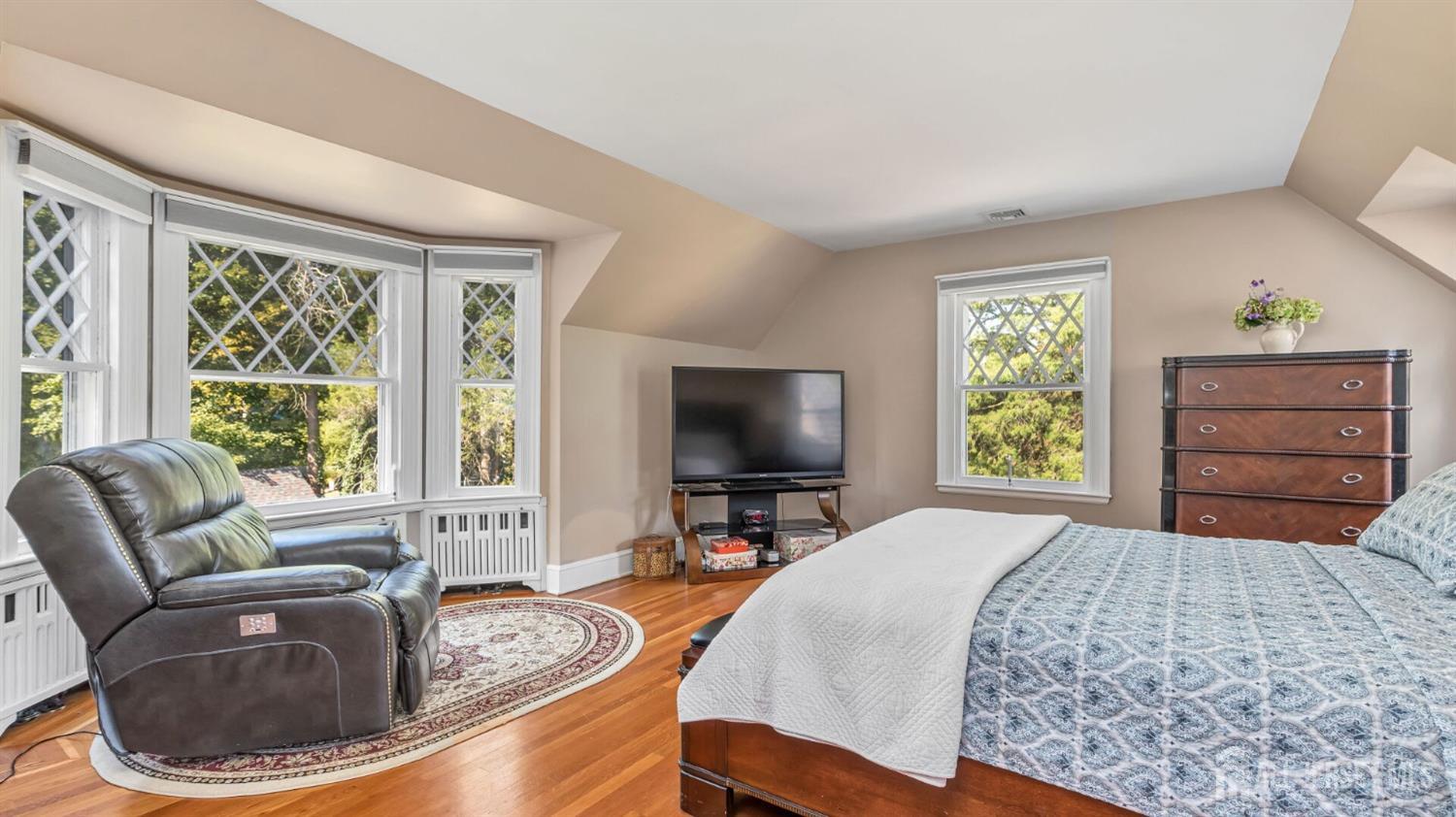 1275 Denmark Road Plainfield, NJ 07062 - Photo 47 of 87 a bedroom with a bed and a couch