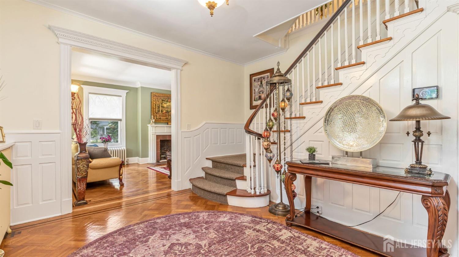 1275 Denmark Road Plainfield, NJ 07062 - Photo 5 of 87 a living room with fireplace furniture a rug and a window