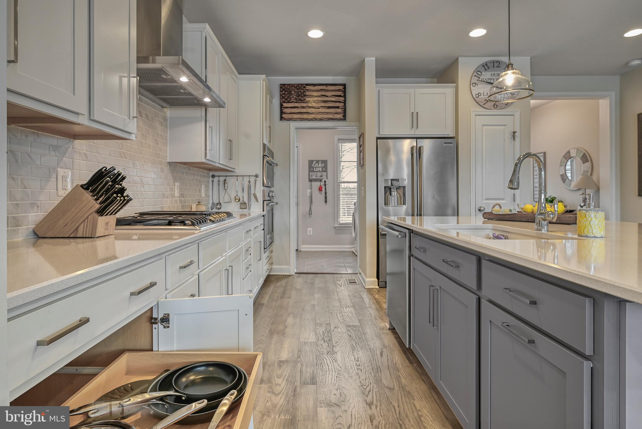287 Sunset Loop Mineral, VA 23117 - Photo 29 of 112 a kitchen with stainless steel appliances a sink stove and refrigerator