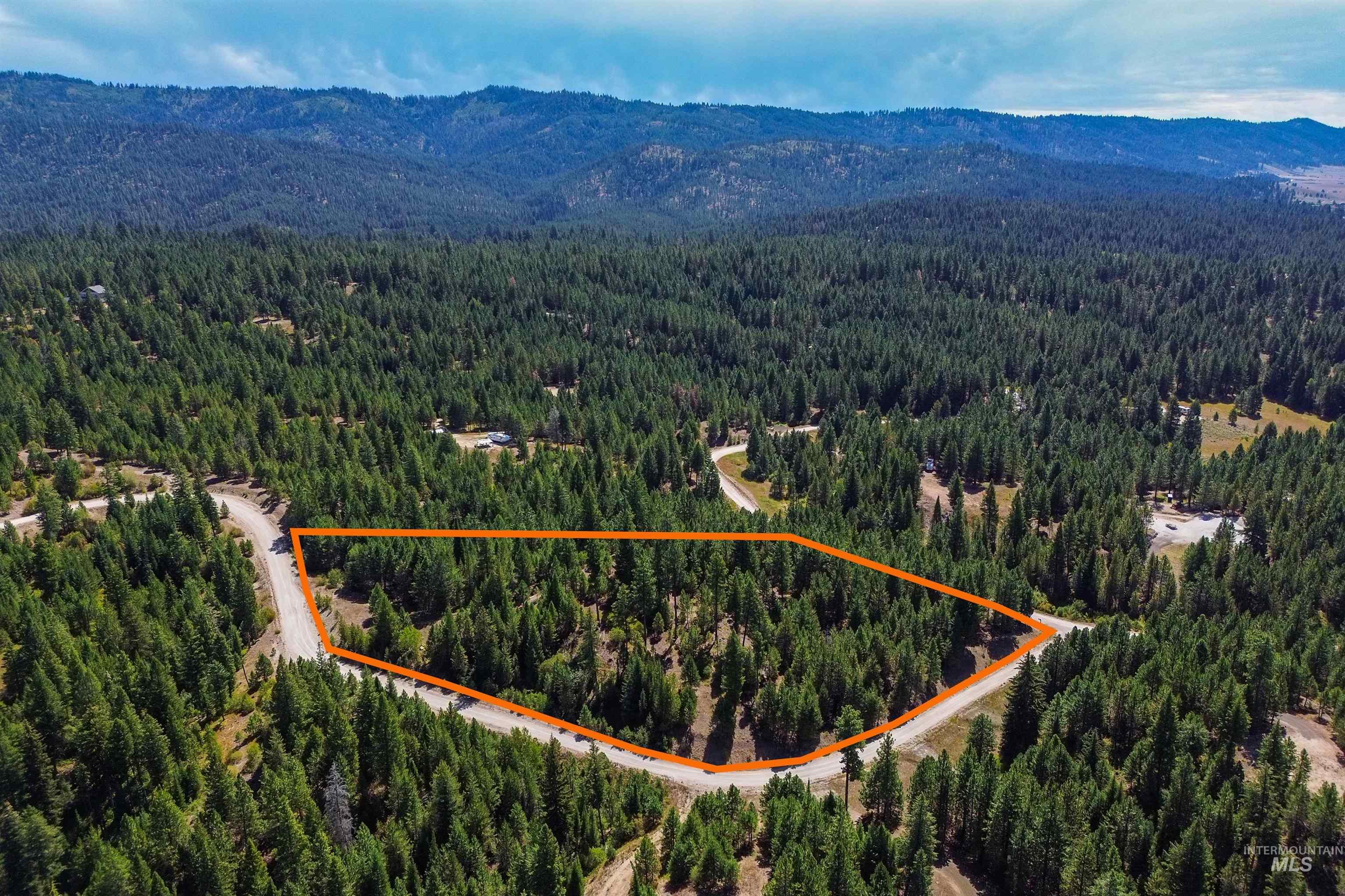 47 Coit Drive Cascade, ID 83611 - Photo 12 of 20 Aerial view of property's location featuring a mountain backdrop and property boundaries highlighted