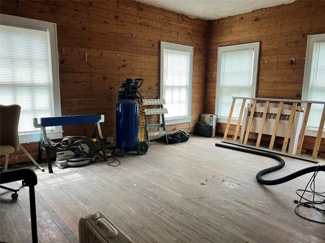 a room with furniture and gym equipment