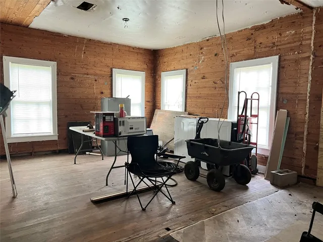 a living room with furniture a window and a table
