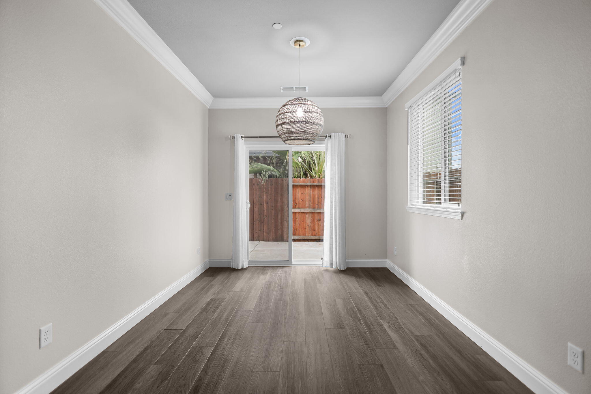 866 Congaree Lane Redding, CA 96001 - Photo 6 of 17 wooden floor in an empty room with a window