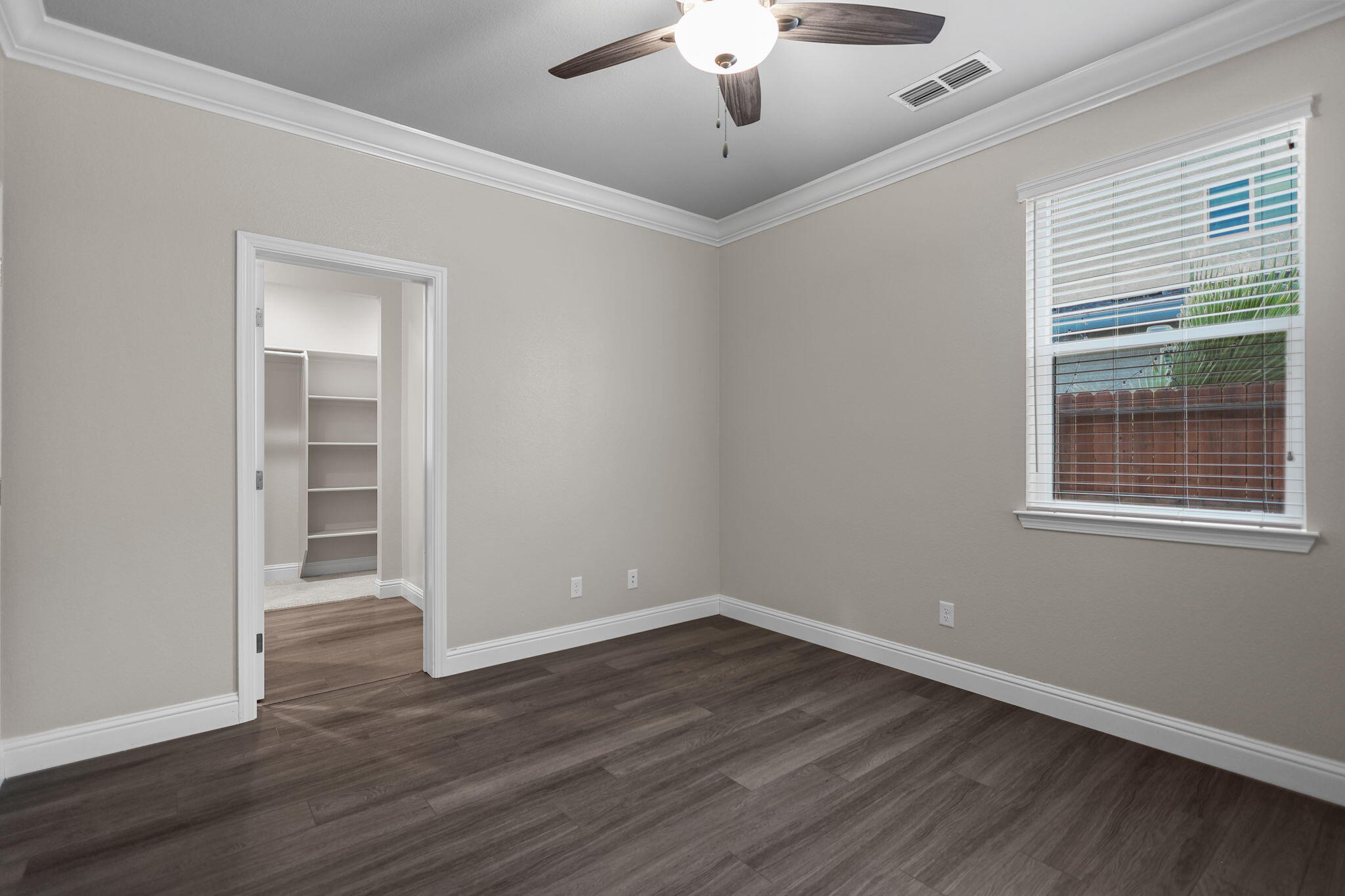 866 Congaree Lane Redding, CA 96001 - Photo 8 of 17 a view of an empty room with wooden floor and a window