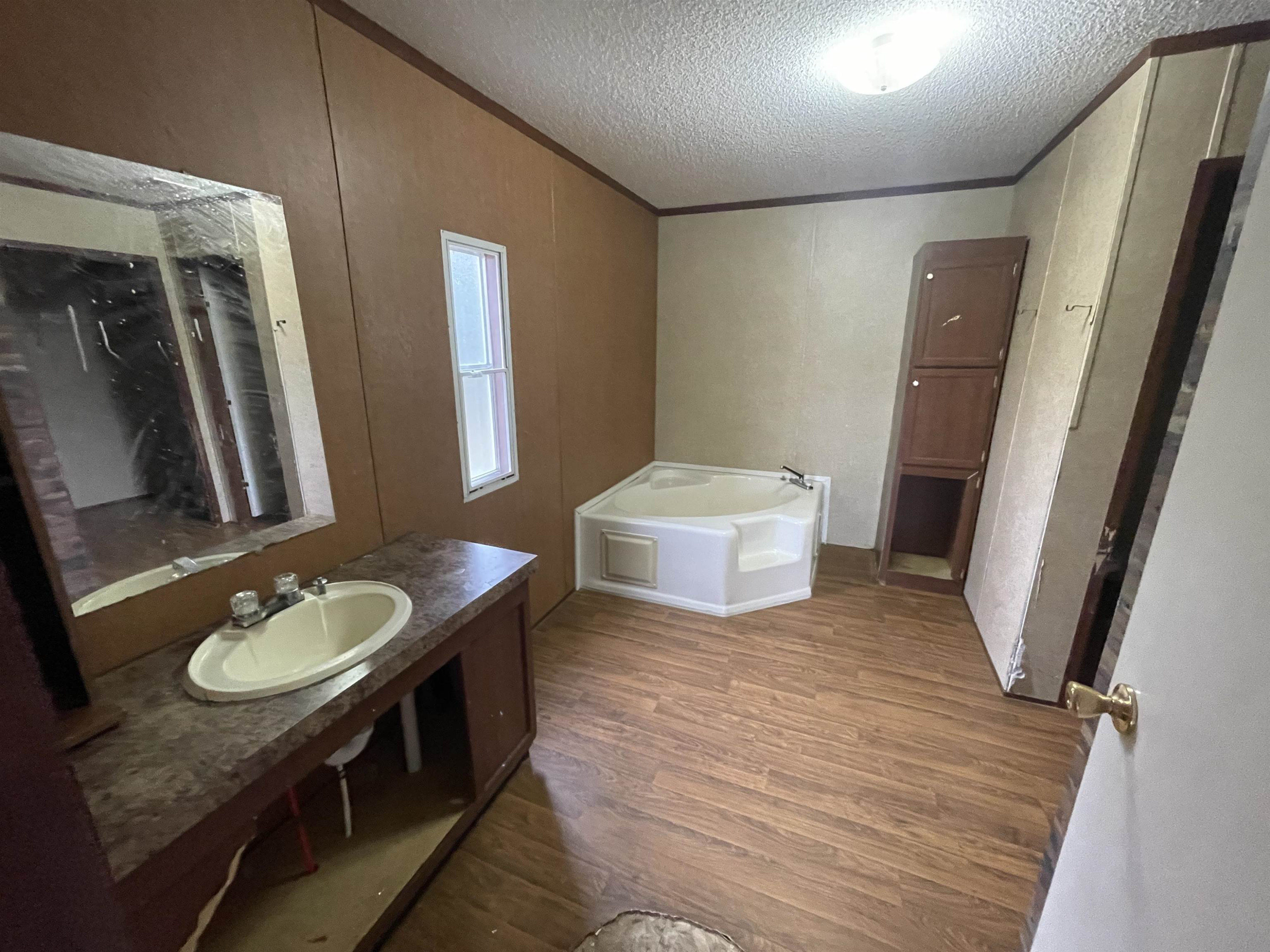 47 Wilkins Road Huron, TN 38345 - Photo 15 of 29 a bathroom with a sink and mirror