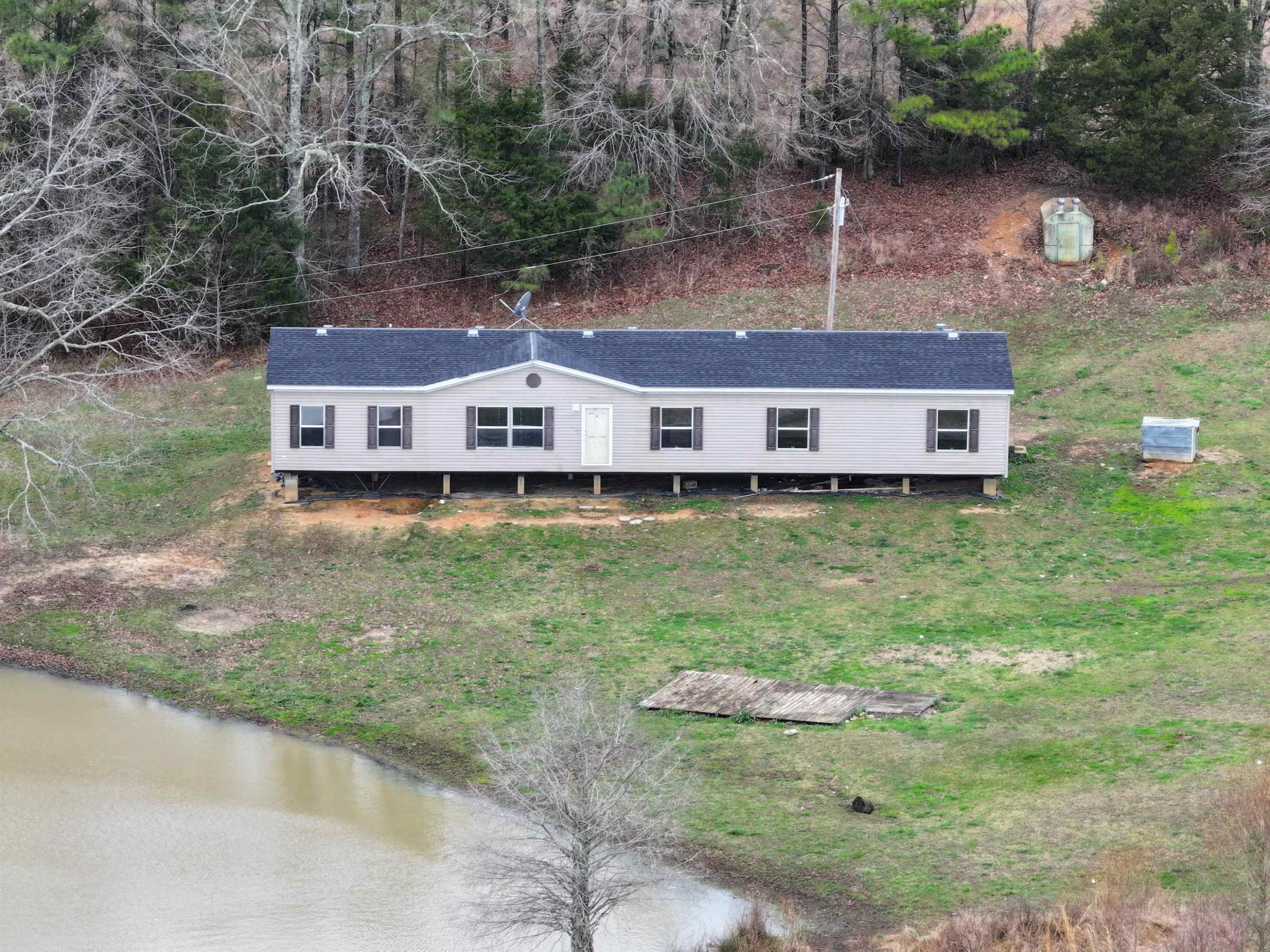 47 Wilkins Road Huron, TN 38345 - Photo 2 of 29 an aerial view of a house with a yard