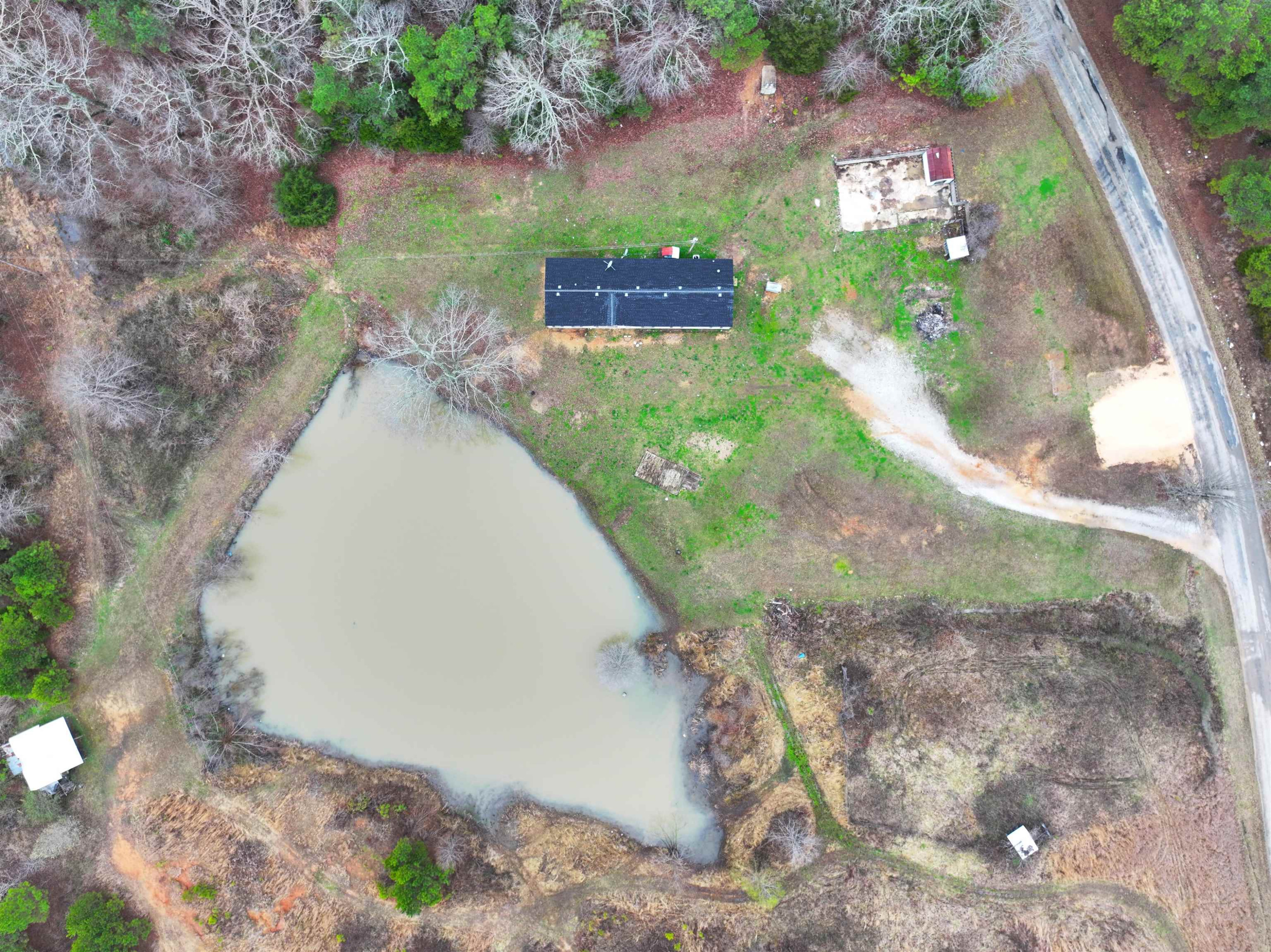 47 Wilkins Road Huron, TN 38345 - Photo 5 of 29 a view of a yard with plants