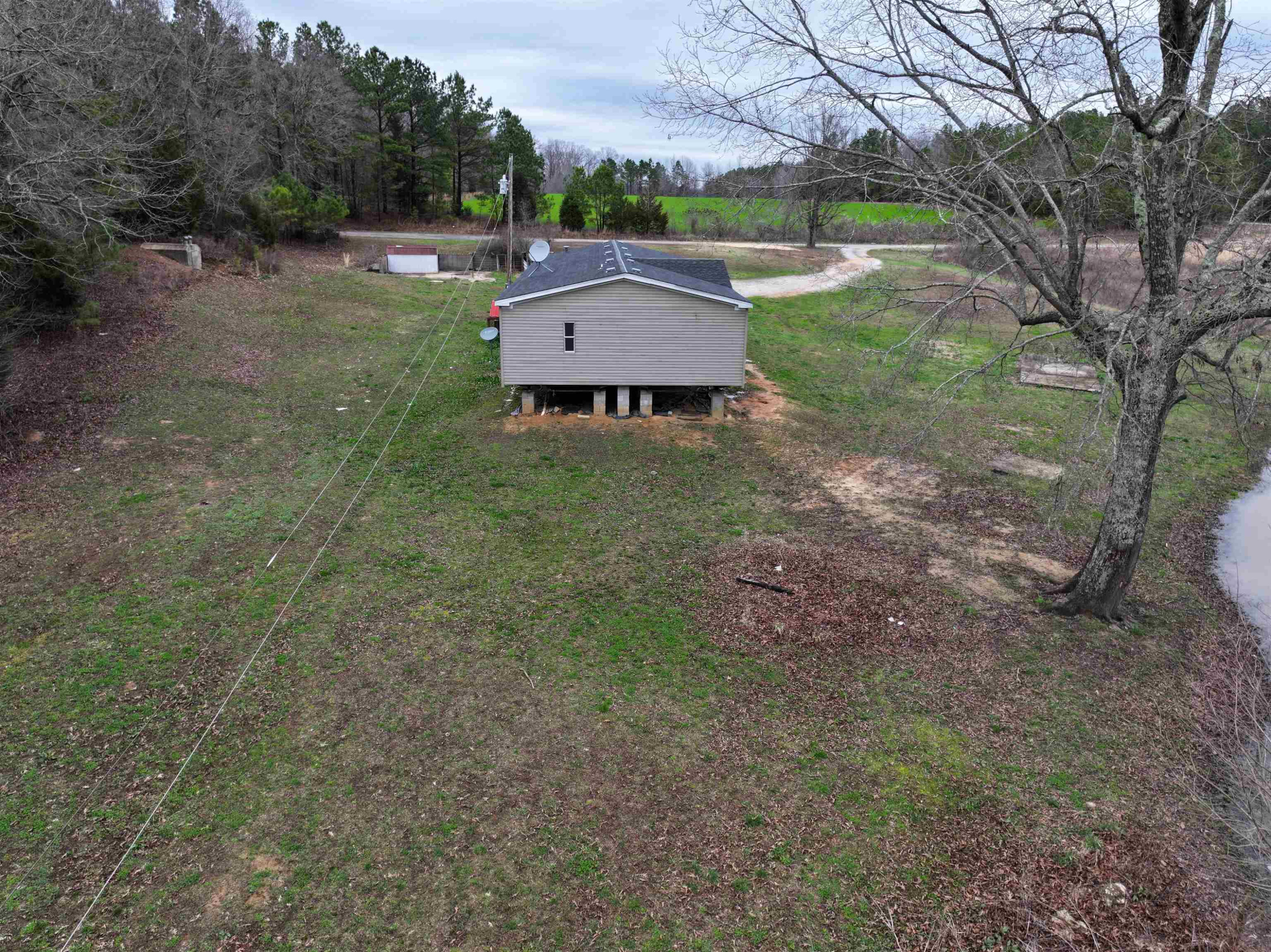 47 Wilkins Road Huron, TN 38345 - Photo 7 of 29 a view of a house with a yard