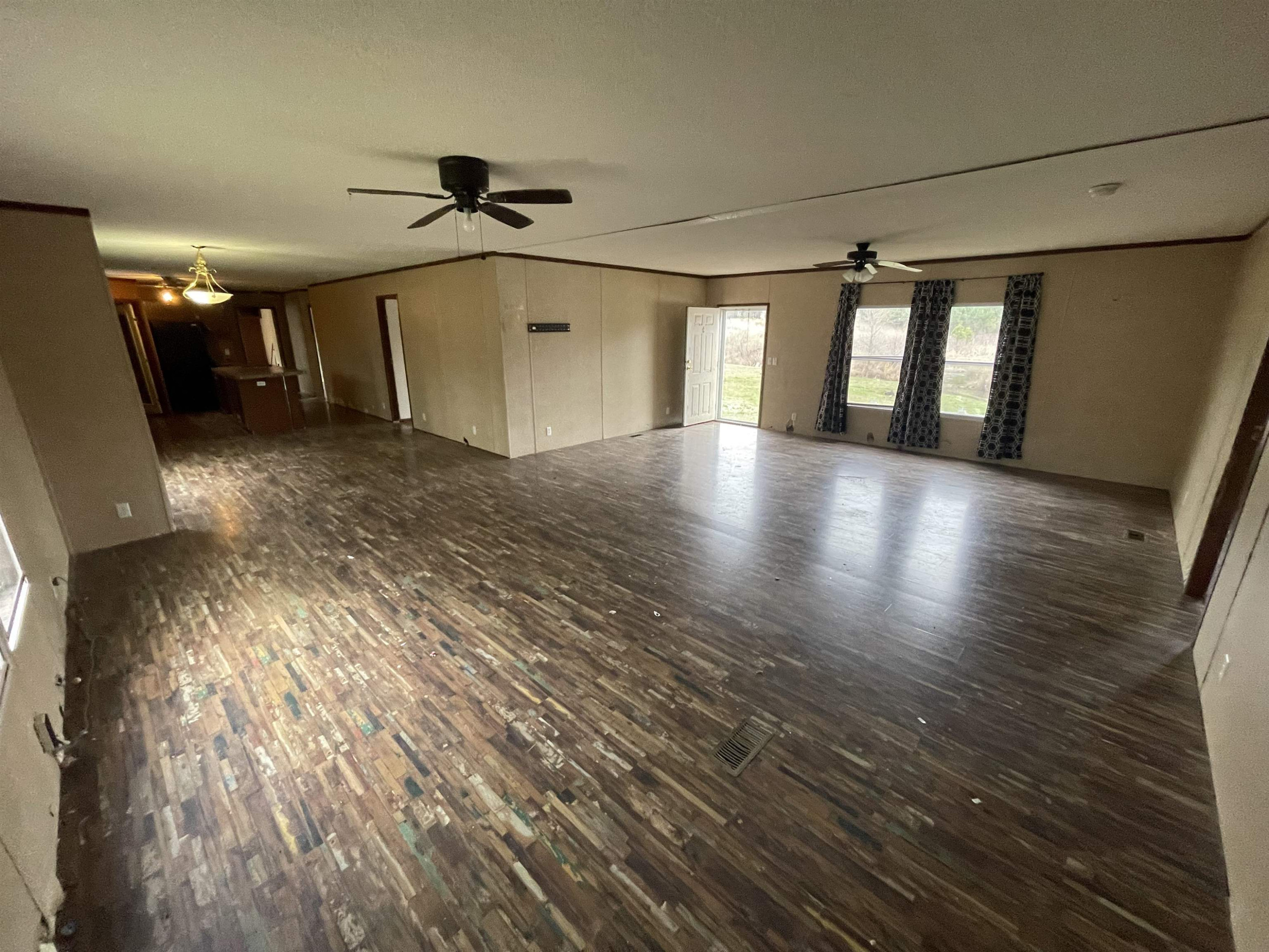 47 Wilkins Road Huron, TN 38345 - Photo 10 of 29 a view of a room with wooden floor