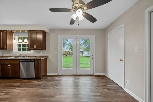 a view of a kitchen with a sink and a window