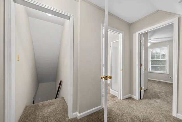 a view of room with a chair and door