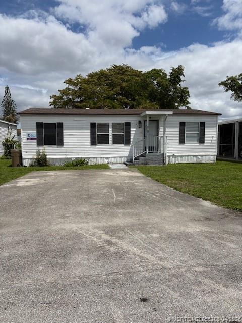 410 Southwest 134th Way Davie, FL 33325 - Photo 1 of 8 a house that has a lot of windows and plants