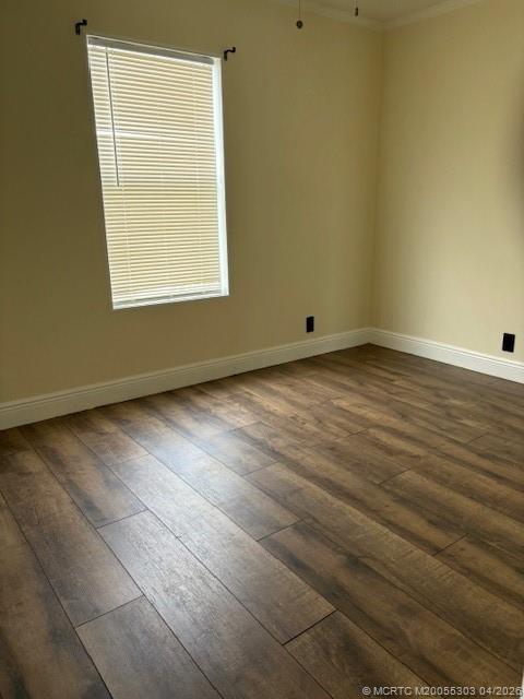 410 Southwest 134th Way Davie, FL 33325 - Photo 5 of 8 an empty room with wooden floor and windows
