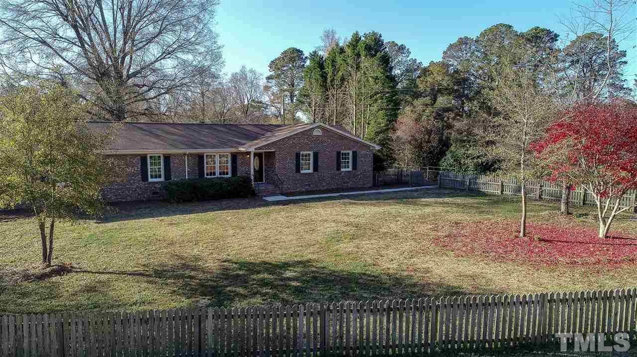 6024 Stancil Farm Road Raleigh, NC 27603 - Photo 12 of 23 a front view of a house with garden