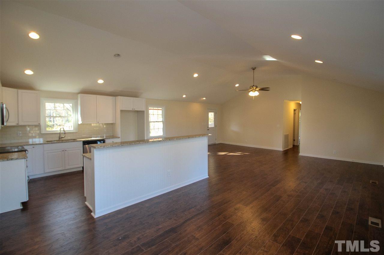 6024 Stancil Farm Road Raleigh, NC 27603 - Photo 3 of 23 a view of kitchen with cabinets and wooden floor