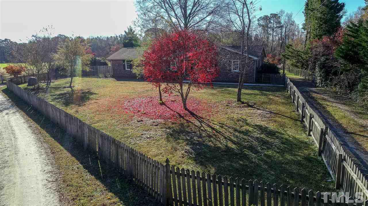 6024 Stancil Farm Road Raleigh, NC 27603 - Photo 7 of 23 a view of a back yard of the house
