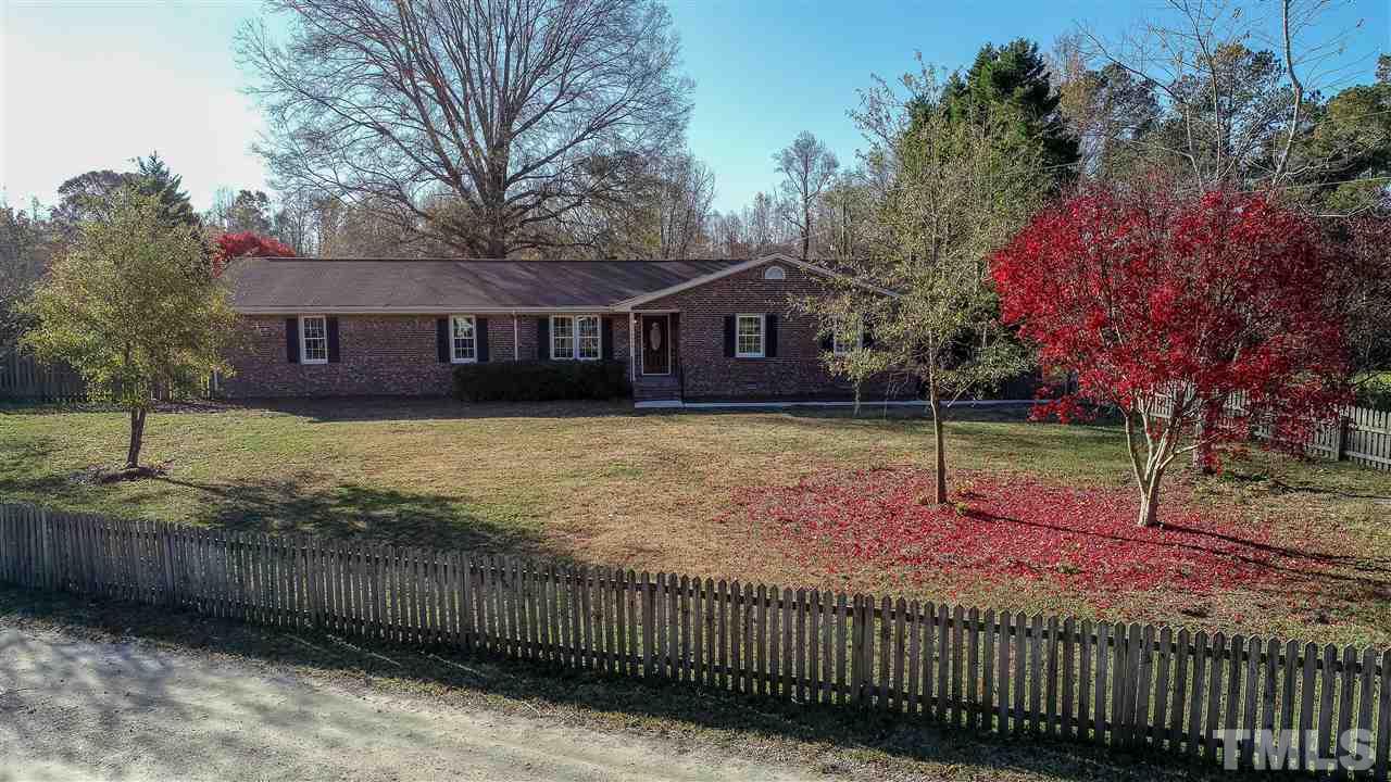 6024 Stancil Farm Road Raleigh, NC 27603 - Photo 9 of 23 a view of a house with a backyard