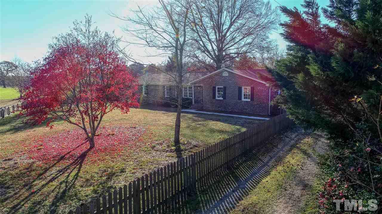 6024 Stancil Farm Road Raleigh, NC 27603 - Photo 10 of 23 a view of a house with a yard