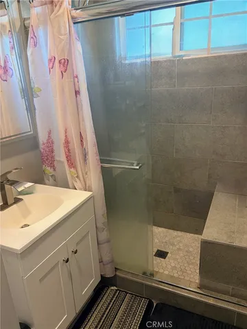 a bathroom with a sink and a shower