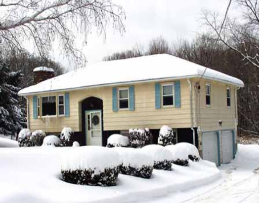 8 Aldrich Road Monson, MA 01057 - Photo 1 of 1 a view of a house with a yard covered in snow