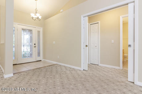 568 Segovia Road St. Augustine, FL 32086 - Photo 6 of 41 en empty room with windows and entrance