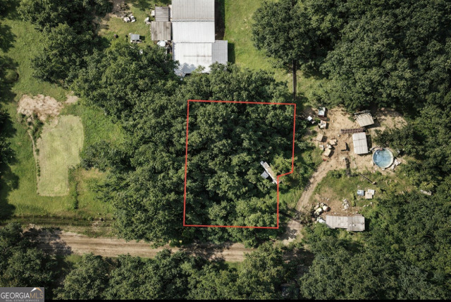 4 2nd Avenue Midway, GA 31320 - Photo 2 of 2 an aerial view of a house with a yard and large trees