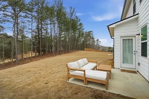 a patio with lake view and a couch