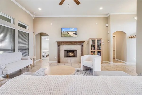 a living room with furniture and a fireplace