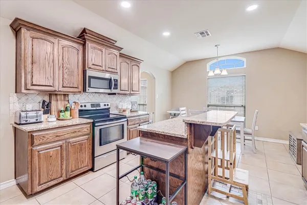a kitchen with a sink cabinets and window