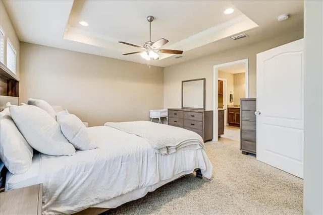 a bathroom with a granite countertop sink toilet and mirror