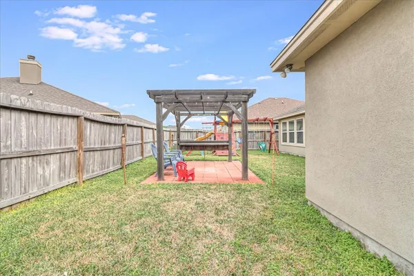 a view of a backyard with a small cabin