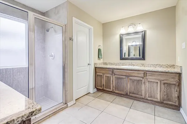 a bathroom with a granite countertop sink mirror and a