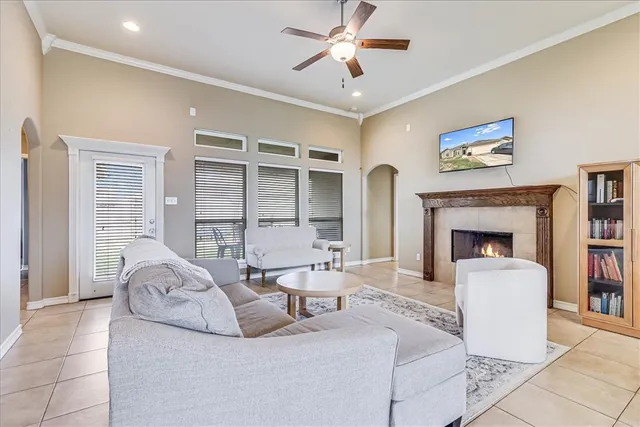 a living room with furniture a table and a fireplace