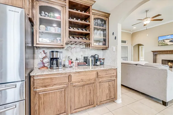 a kitchen with cabinets and window